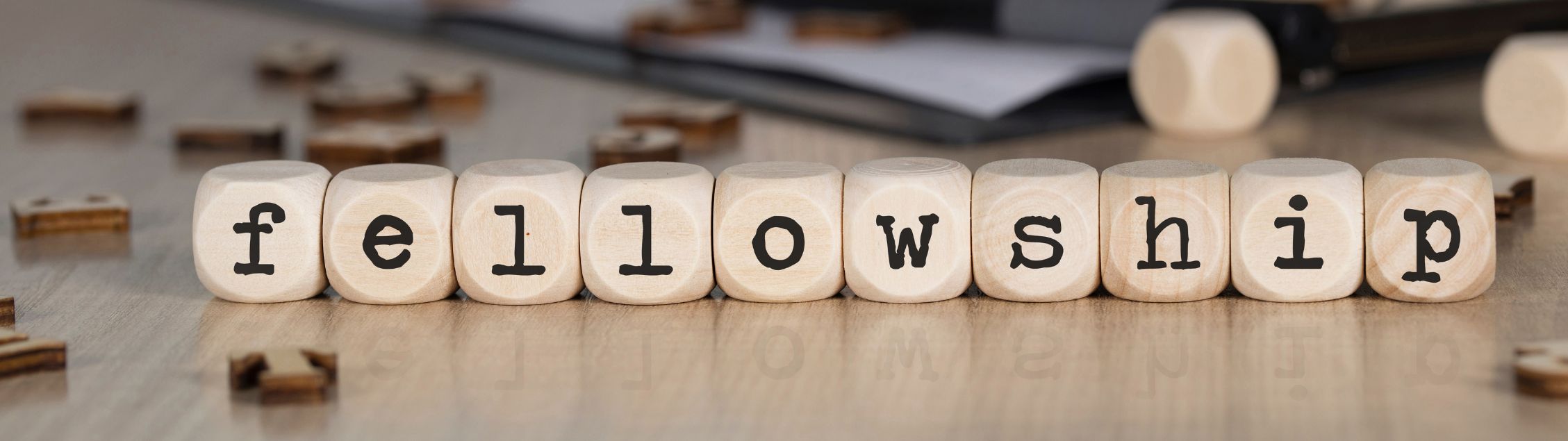 Letter blocks spelling the word fellowship