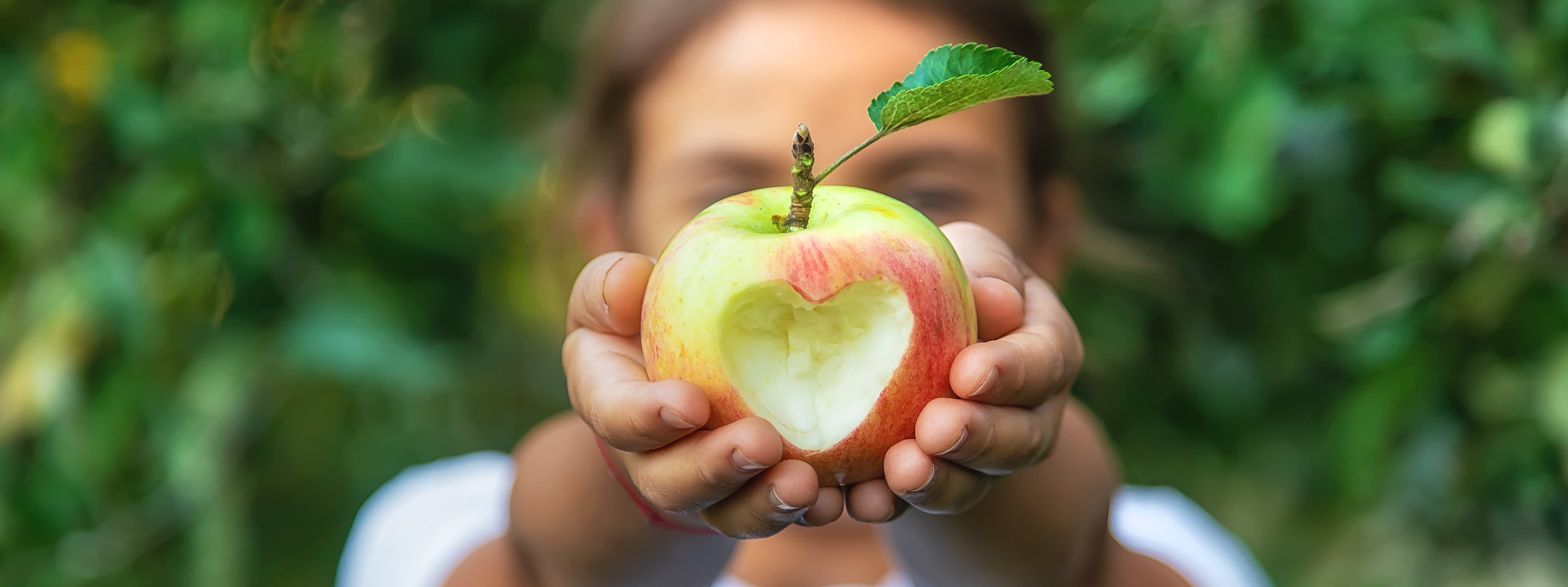 Child holding an apple