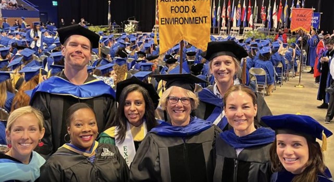 Faculty pose at graduation ceremony