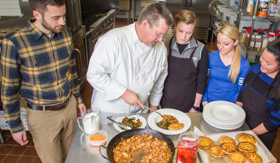 Students watching the chef prepare food